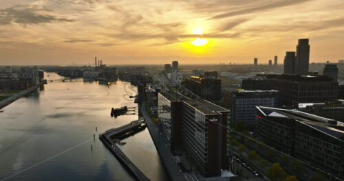 Video Aerial drone view of the Islands Brygge harbourfront area in central Copenhagen, Denmark at sunset - Starpik