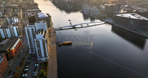 Video Aerial drone view of the Islands Brygge harbourfront area in central Copenhagen, Denmark at sunset - Starpik