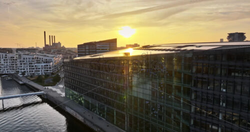 Video Aerial drone view of the Islands Brygge harbourfront area in central Copenhagen, Denmark at sunset - Starpik