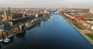 Video Aerial drone view of the Islands Brygge harbourfront area in central Copenhagen, Denmark at sunset - Starpik