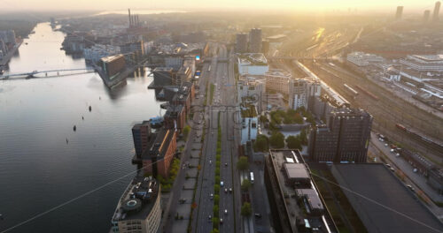 Video Aerial drone view of the Islands Brygge harbourfront area in central Copenhagen, Denmark at sunset - Starpik