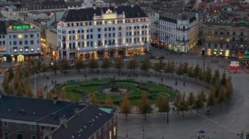 Video Aerial drone view of the Kongens Nytorv public square in Copenhagen, Denmark at night - Starpik