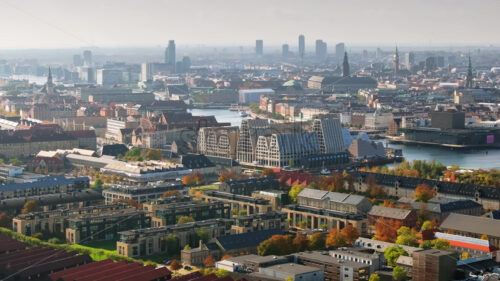 Video Aerial drone view of the Paper Island urban oasis surrounded by water in Copenhagen, Denmark in daylight - Starpik