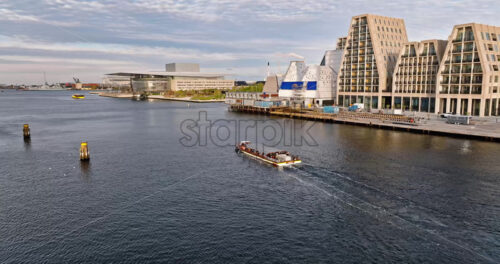 Video Aerial drone view of the Paper Island urban oasis surrounded by water in Copenhagen, Denmark in daylight - Starpik