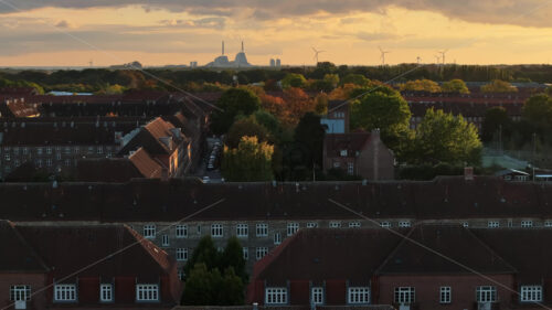 Video Aerial drone view of the Paper Island urban oasis surrounded by water in Copenhagen, Denmark in the evening - Starpik