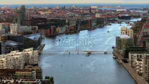 Video Aerial drone view of the Quay Bridge across the port of Copenhagen, Denmark in the evening - Starpik