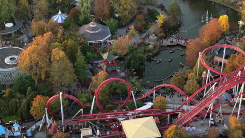 Video Aerial drone view of the Tivoli amusement park and the City Hall in Copenhagen, Denmark at sunset - Starpik