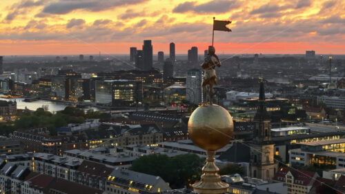 Video Aerial drone view of the top of the Church of Our Saviour in the city centre of Copenhagen, Denmark at sunset - Starpik