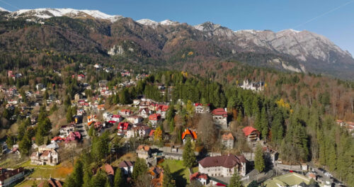 Video Aerial drone view of Sinaia, Romania, in the Bucegi Mountains, surrounded by ski trails - Starpik