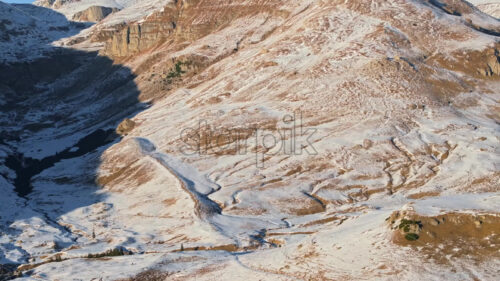 Video Aerial drone view of a little snow on the Bucegi Mountains, near Brasov, Romania - Starpik