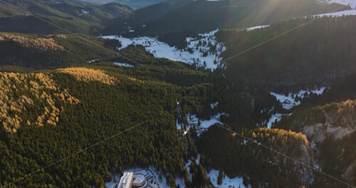 Video Aerial drone view of a little snow on the Bucegi Mountains, near Brasov, Romania - Starpik