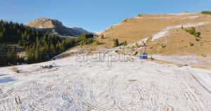 Video Aerial drone view of a little snow on the Bucegi Mountains, near Brasov, Romania - Starpik