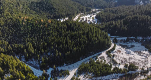 Video Aerial drone view of a little snow on the Bucegi Mountains, near Brasov, Romania - Starpik