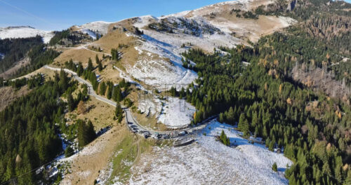 Video Aerial drone view of a little snow on the Bucegi Mountains, near Brasov, Romania - Starpik