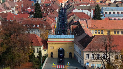 Video Aerial drone view of cars passing under the Schei Gate in Brasov, Romania - Starpik