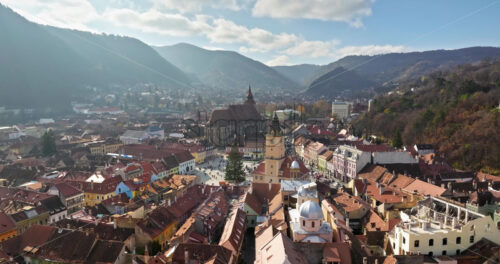 Video Aerial drone view of the Christmas tree being installed in The Council Square in the historic center of Brasov, Romania - Starpik