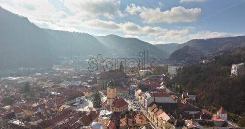 Video Aerial drone view of the Christmas tree being installed in The Council Square in the historic center of Brasov, Romania - Starpik