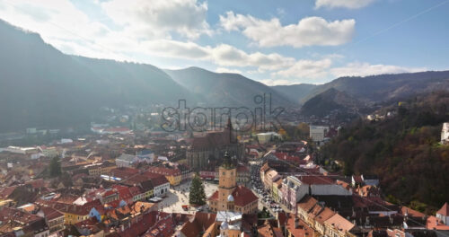 Video Aerial drone view of the Christmas tree being installed in The Council Square in the historic center of Brasov, Romania - Starpik