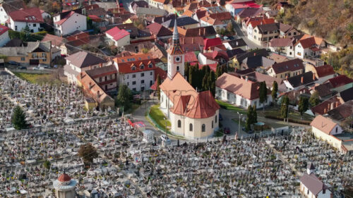 Video Aerial drone view of the St. Nicholas Church near a cemetery in Brasov, Romania - Starpik