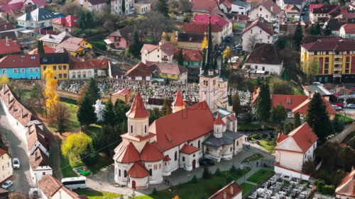 Video Aerial drone view of the St. Nicholas Church near a cemetery in Brasov, Romania - Starpik