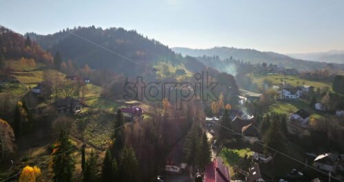 Video Aerial drone view of the commune in Brasov County, Transylvania, Romania - Starpik