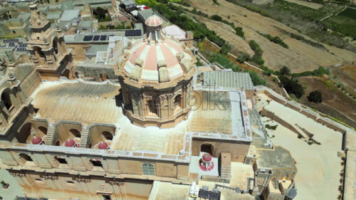 Video Aerial drone view of the walled city of Valletta, Malta, surrounded by the Mediterranean sea in daylight - Starpik