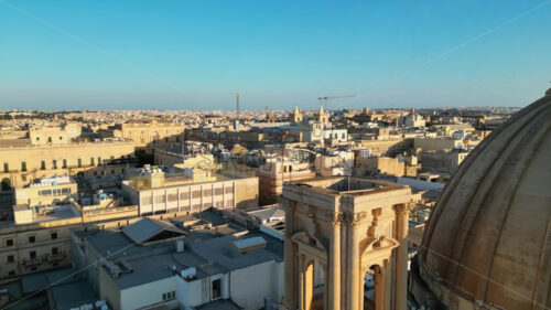 Video Aerial drone view of the walled city of Valletta, Malta, surrounded by the Mediterranean sea in daylight - Starpik