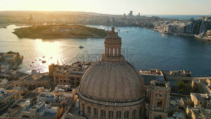 Video Aerial drone view of the walled city of Valletta, Malta, surrounded by the Mediterranean sea in daylight - Starpik