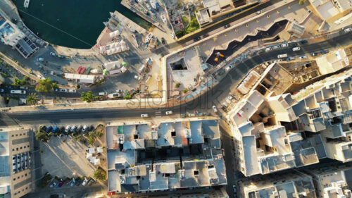 Video Aerial drone view of the walled city of Valletta, Malta, surrounded by the Mediterranean sea in daylight - Starpik