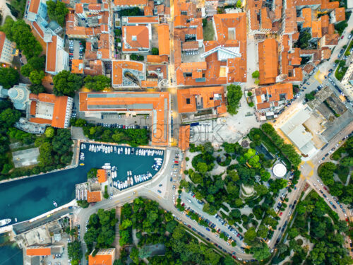 Aerial drone vertical view of Zadar, Croatia. Historical city centre with old buildings, narrow streets and water channels - Starpik