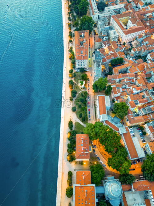 Aerial drone vertical view of Zadar in evening, Croatia. Historical city with old buildings, narrow streets and Adriatic sea coast - Starpik