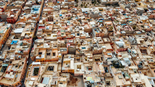 Aerial drone view of Marrakesh, Morocco. View of multiple old residential buildings made in national style - Starpik