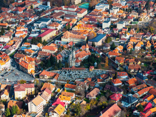 Aerial drone view of St. Nicholas Church and The First Romanian School Museum in Brasov, Prund-Schei quarter, Romania - Starpik