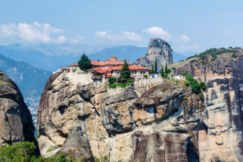 Aerial sunset view on monastery at coast of mountains. Greece, Corfu - Starpik