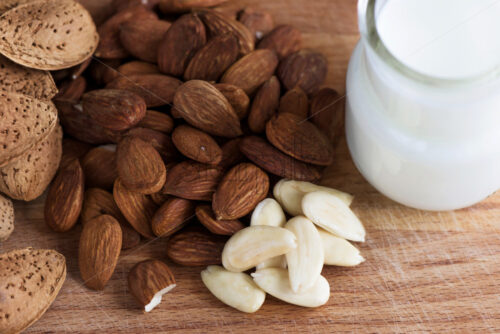 Almond nuts with white milk macro close up composition - Starpik