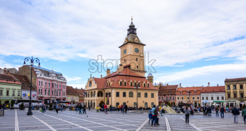 BRASOV, ROMANIA – OCTOBER 27, 2018: Historical architecture buildings and museum of history in the old city square. People exploring local beauties - Starpik