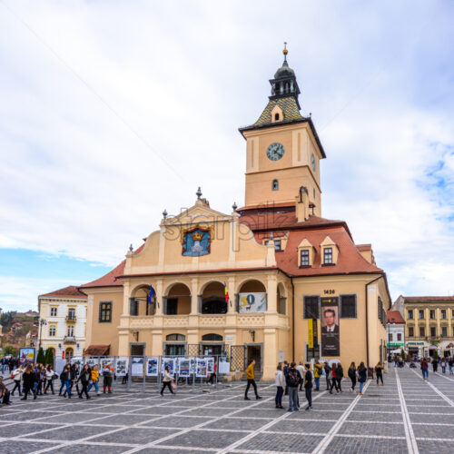 BRASOV, ROMANIA – OCTOBER 27, 2018: Museum of History in old city square at daylight. Bottom view. Blue sky with clouds. Romania tourist spots - Starpik