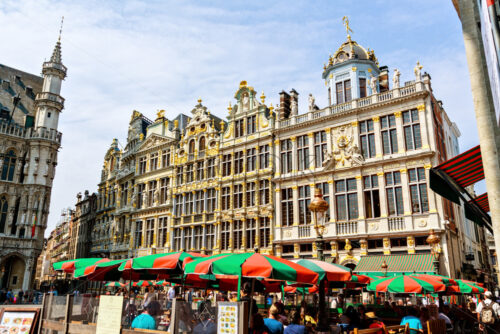 BRUSSELS, BELGIUM – MAY 9, 2018: City buildings facade at Grand Place in a sunny day. Bright clear sky on background. Negative copy space, place for text. Brussels, Belgium - Starpik