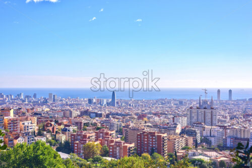 Barcelona city View from Park Guell at sunrise. Beautiful blue sky - Starpik