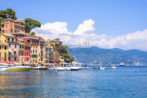 Beautiful daylight view to ships on water and buildings in Portofino city - Starpik