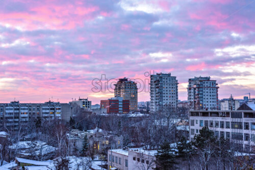 Beautiful sunset in Chisinau town. Warm light reflecting on buildings. Purple blue sky on background. Negative copy space, place for text. Moldova beauties - Starpik