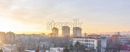 Beautiful sunset in Chisinau town. Warm light reflecting on buildings. Purple blue sky on background. Negative copy space, place for text. Moldova beauties - Starpik