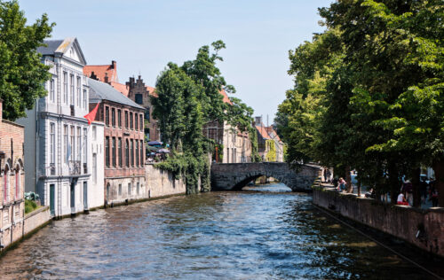 Belfry of Bruges and the famous river. Belgium landmarks - Starpik