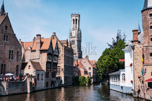 Belfry of Bruges and the famous river. Belgium landmarks - Starpik