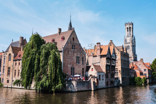 Belfry of Bruges and the famous river. Belgium landmarks - Starpik