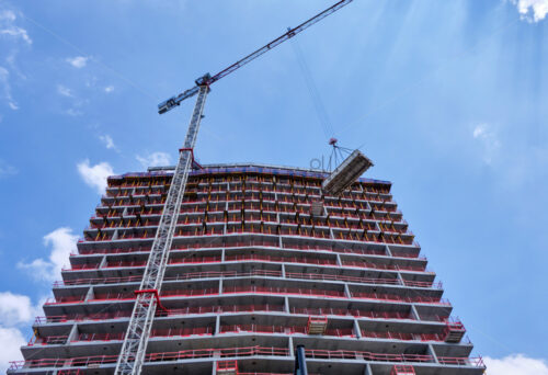 Building in construction. Crane working. Low shot. Antwerp, Belgium - Starpik