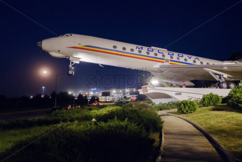 CHISINAU, MOLDOVA – 25 AUGUST, 2018: the monument of an airplane next to the airport at night - Starpik