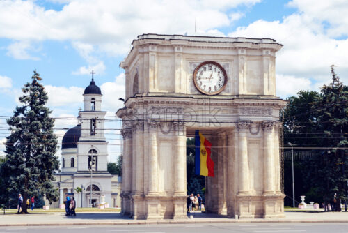 CHISINAU, MOLDOVA – JUNE 24, 2018: the triumphal arch of the city center and main square with people - Starpik