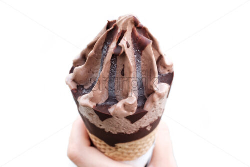 Chocolate ice cream cone isolated on white, close up - Starpik