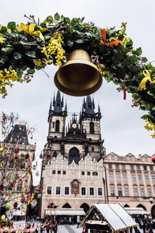 Church of Our Lady before Tyn and colorful spring flowers arch. Cloudy and dramatic sky on background. Prague, Czech Republic - Starpik